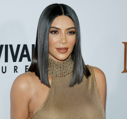 Kim Kardashian - Sleek straight black lob hairstyle.